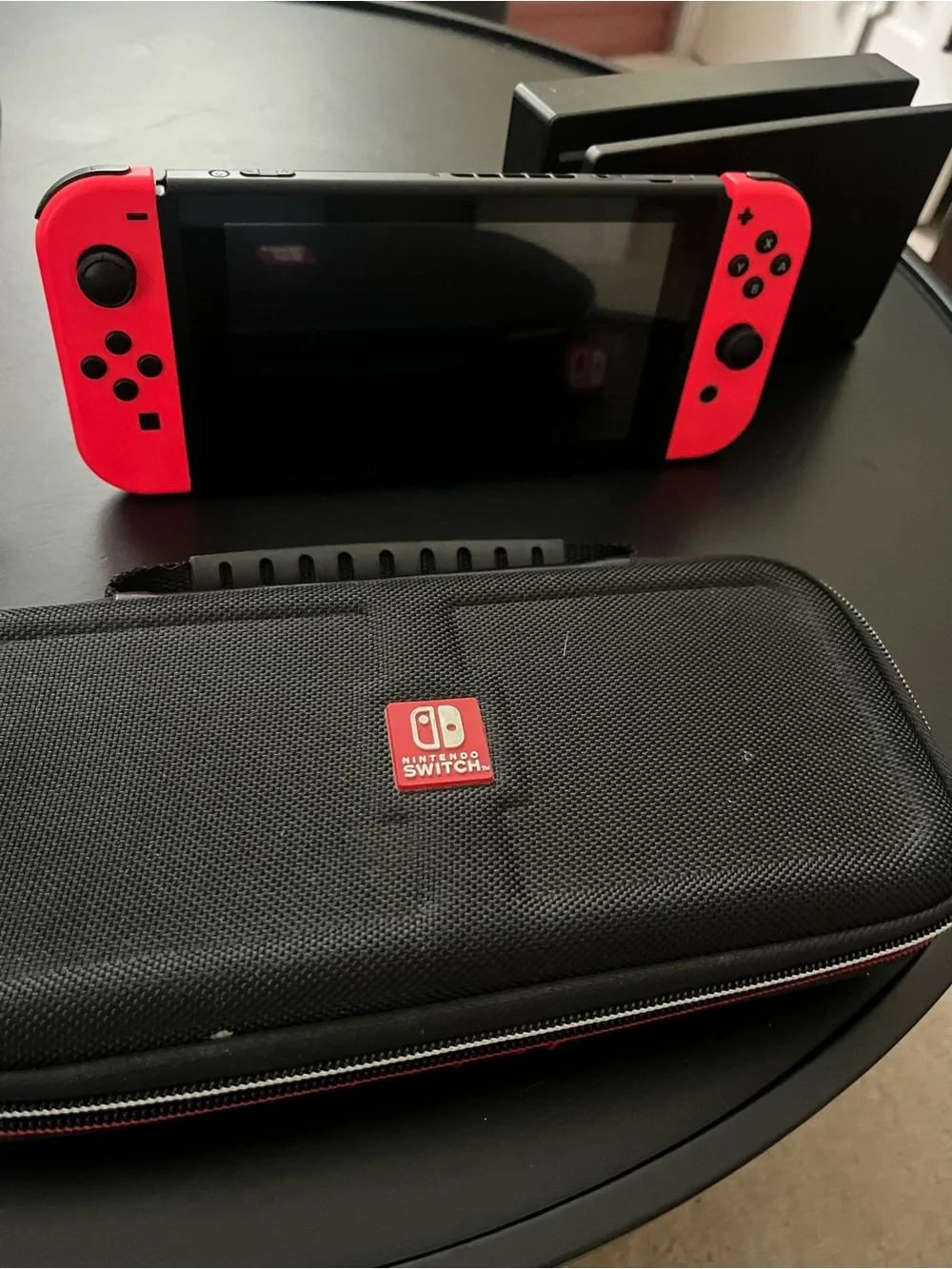 Nintendo Switch console with Neon Red and Neon Blue Joy-Con Controllers